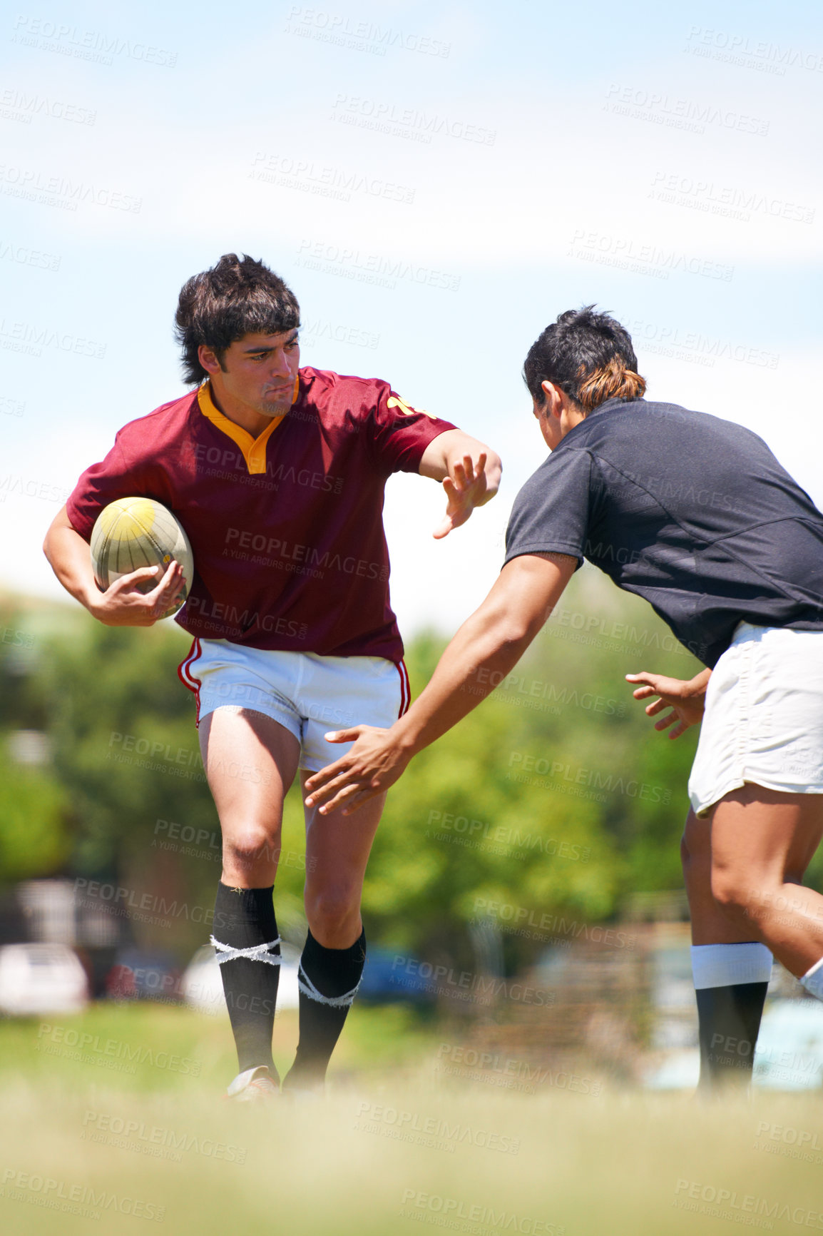 Buy stock photo Rugby player, game and tackle on a field during competitive sport match outdoors. Teamwork, training and playing professional athletic exercise in uniform to avoid person outdoor for practice 