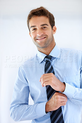Buy stock photo Businessman, portrait and happy or dressing with shirt, professional or employee at corporate job. Entrepreneur, face and person for smile, confidence and pride with calm expression or hands at work 