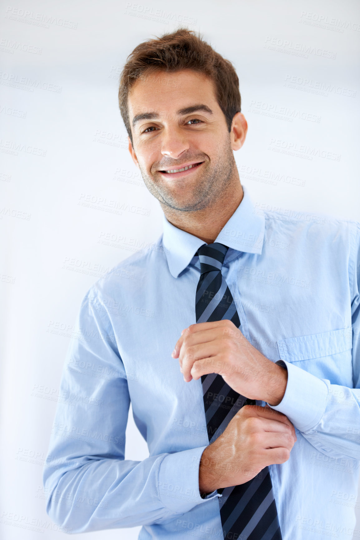 Buy stock photo Businessman, portrait and happy or dressing with shirt, professional or employee at corporate job. Entrepreneur, face and person for smile, confidence and pride with calm expression or hands at work 