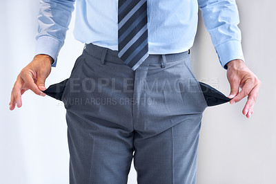 Buy stock photo Hands, bankrupt and broke with pockets of a business person in studio on a white background. Economy, debt or financial crisis and a poor or jobless employee with poverty problems during a recession