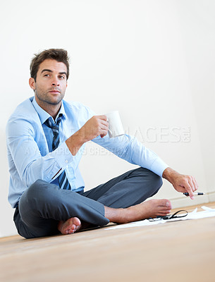 Buy stock photo Thinking, coffee and business man on floor in office for brainstorming, solution and problem solving. Corporate, professional and entrepreneur with ideas for company, career and job in workplace