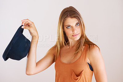 Buy stock photo Portrait, fashion and serious woman with hat in studio for style, clothing or choice on white background. Hand holding, bowler and face of female model with gesture, decision or fashionable outfit