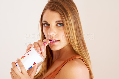 Buy stock photo Woman, drinking or soda with confident portrait in studio mockup or wellness on vacation. Model, smoothie or face on sip straw for fizzy pop, thirsty or sweet seltzer for teenager by white background