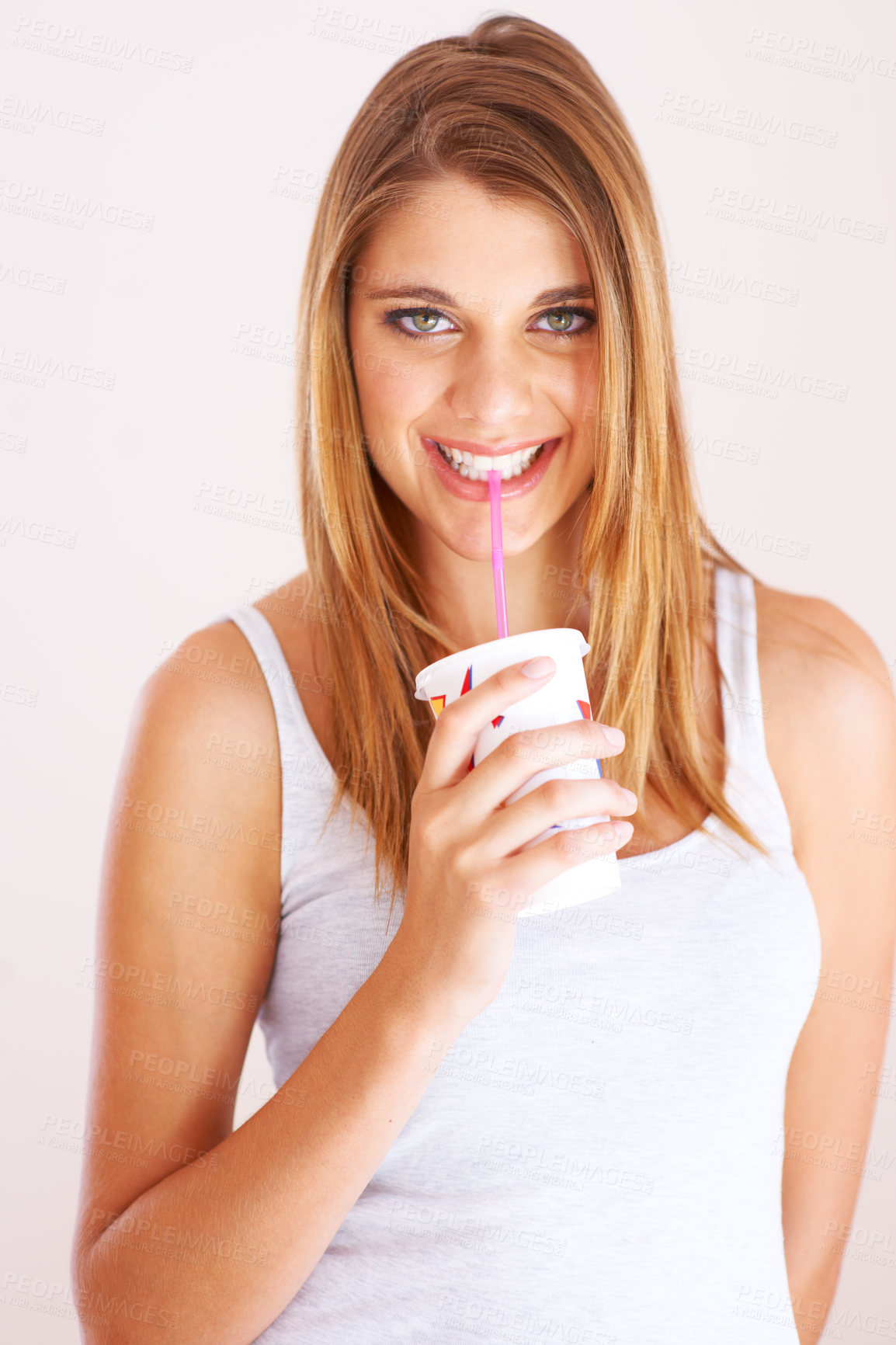 Buy stock photo Woman, portrait and drink cup of soda, fizzy cola and ice cold milkshake in studio on white background. Thirsty, happy and young girl sip on straw for takeaway smoothie, juice and fast food beverage