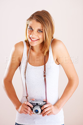 Buy stock photo Portrait, smile and shy woman with camera in studio for photography, memory or nature on white background. Face, happy and female photographer with equipment for creative hobby, career or shooting