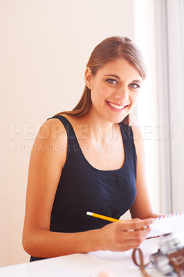 Buy stock photo Woman, writing or pencil with portrait on table, happy or communication for envelope message in home. Young person, smile and face with letter, happiness and retro postage service in apartment