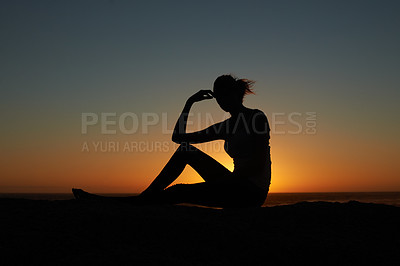 Buy stock photo Sunset, silhouette and woman at a beach relax, resting and enjoying quiet morning on sky background. Sunrise, shadow and female person at the ocean for travel, freedom and peaceful me time in nature