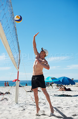 Buy stock photo Volleyball, man and fitness at beach with ball serve, energy or freedom on blue sky background. Seaside, sports or male player with handball in nature for cardio, workout or athletic game performance