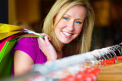 Buy stock photo Happy, retail and portrait of a woman doing shopping, discount and clothes search in a store. Smile, fashion and a real person with bags from a boutique, buying clothing and looking for a deal