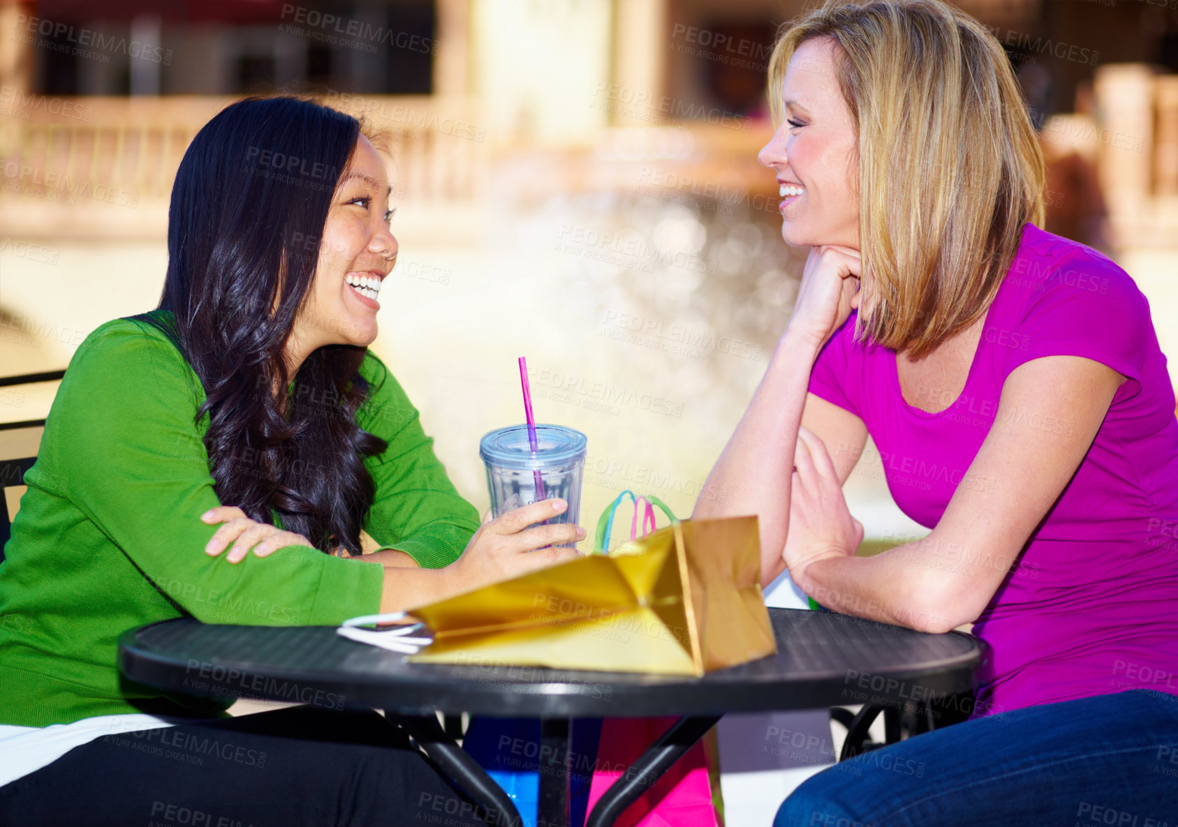 Buy stock photo Happy, talking and women at a cafe for drinks, lunch or conversation for bonding. Smile, table and diversity with friends speaking while at a coffee shop for communication, breakfast or brunch