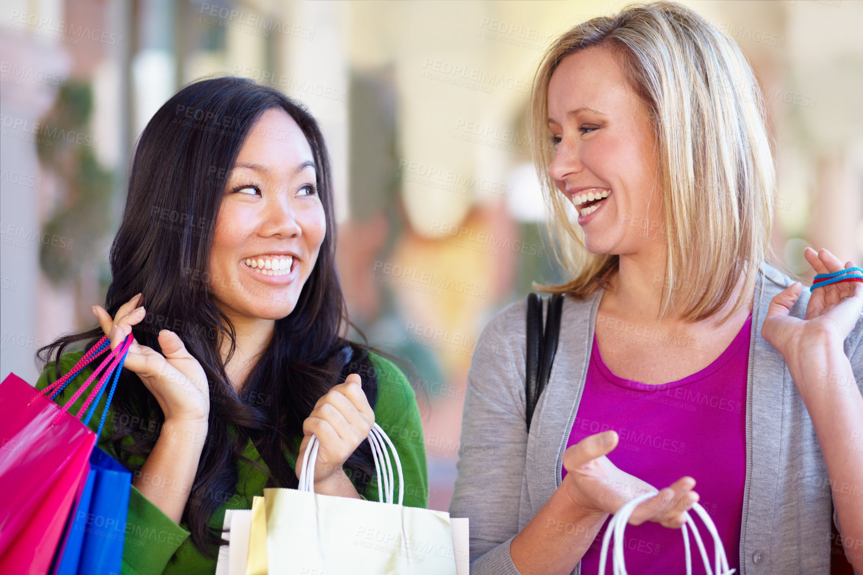 Buy stock photo Happy, sale and women with bags from shopping in the city or mall and excited about a deal. Smile, conversation and diversity with female friends talking while at a shop for clothes and fashion