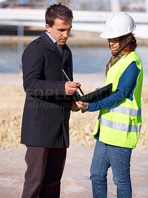 Buy stock photo Clipboard, construction worker and business man at site inspection, building advice or compliance feedback. Engineering, contractor or woman with partner for industry checklist of project management 