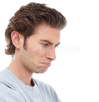 Buy stock photo Handsome young man looking down disappointedly - profile