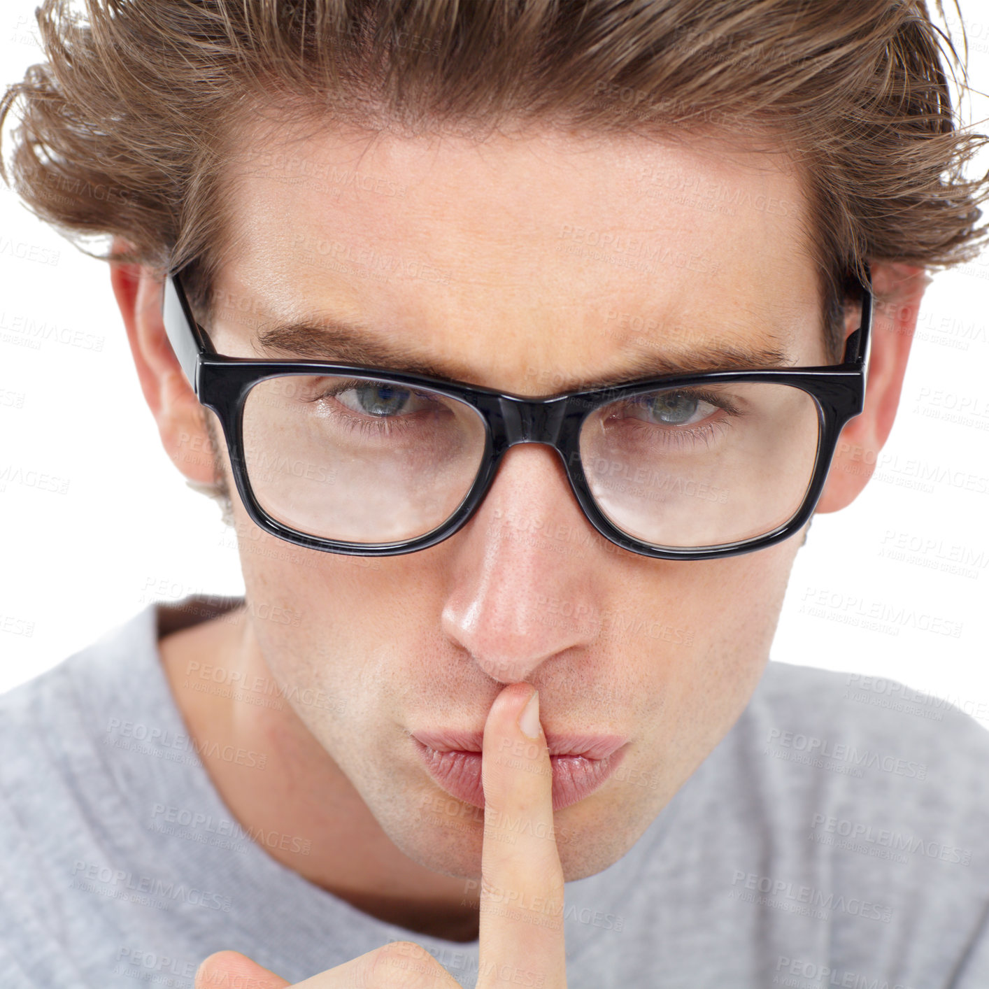 Buy stock photo Secret, face and man in studio for sign of privacy, noise and confidential trust on white background. Portrait, guy with glasses and finger on lips for quiet, gossip news and mystery emoji to whisper