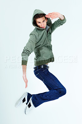 Buy stock photo Portrait of a young man posing in the air
