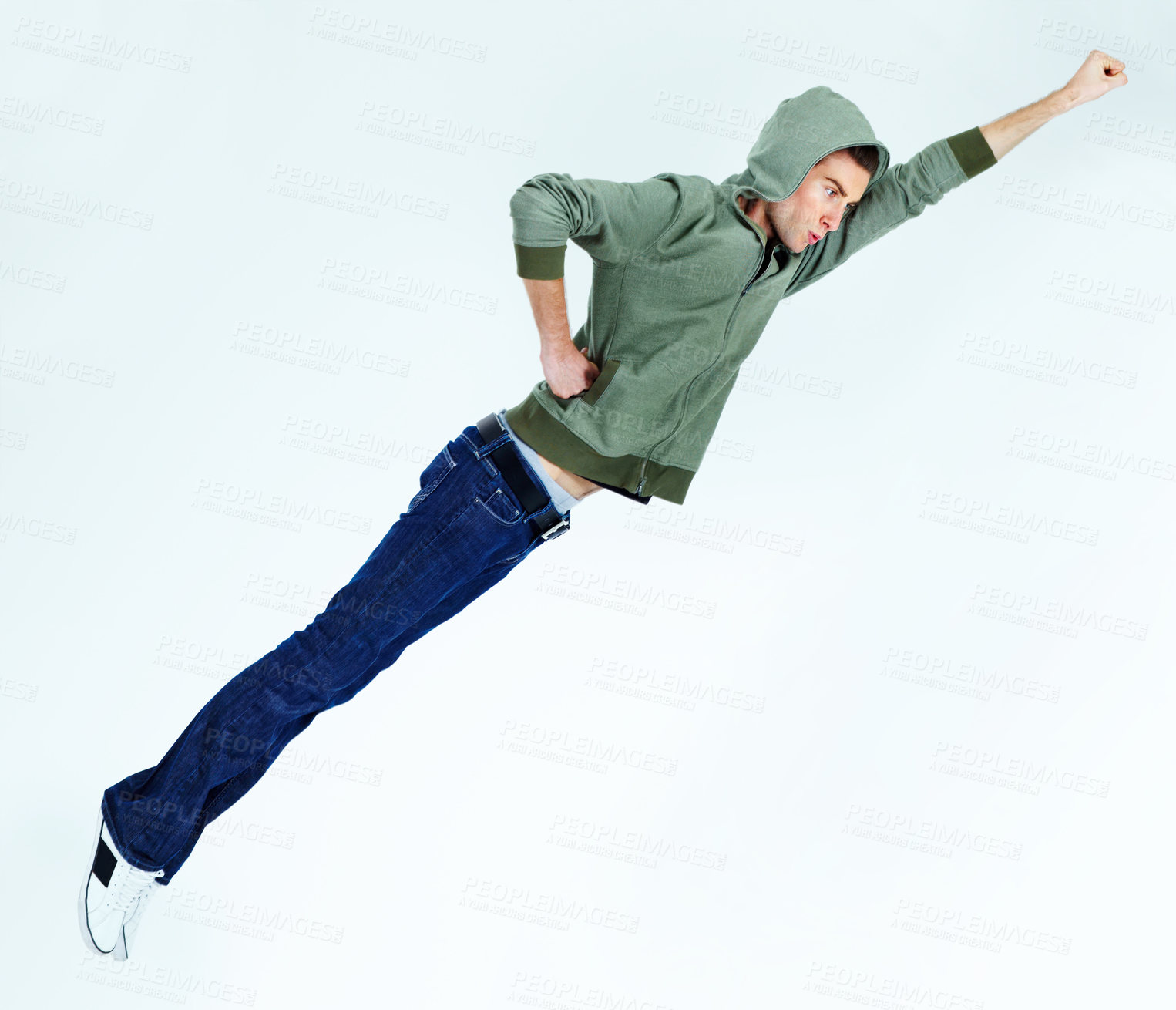 Buy stock photo Man in flying, superhero pose with fashion and stylish streetwear casual clothes isolated on white background. Energy, carefree with young male model is soaring and posing in jeans and hoodie