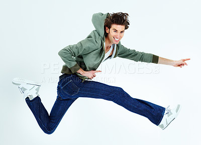 Buy stock photo Portrait of a young man leaping happily