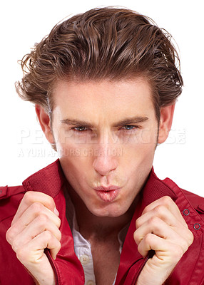 Buy stock photo Handsome young man holding his collar and whistling at the camera