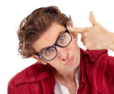 Buy stock photo Finger gun, portrait and man in a studio with a comic silly, funny and goofy face expression. Crazy, quirky and male model with glasses posing with a shoot gesture isolated by a white background.