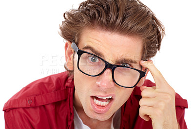 Buy stock photo Portrait, confused and crazy with a man in studio isolated on a white background thinking about problem solving. Question, doubt or comic with a handsome young male geek looking silly wearing glasses