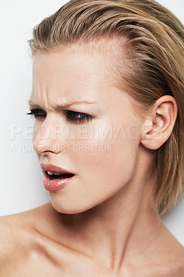 Buy stock photo An young woman looking at something with offense