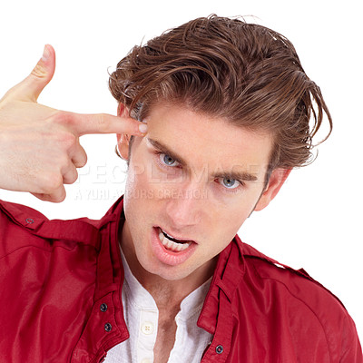 Buy stock photo Portrait, finger gun and crazy with a man in studio isolated on a white background for anger or frustration. Fashion, temple or problem and an aggressive young person pointing to his face or head