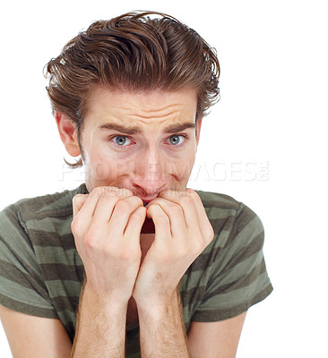 Buy stock photo Man, nervous and biting nails in studio portrait for mental health, fear or worry by white background. Male student, young guy or scared with stress, anxiety or problem with mistake, confused or fail