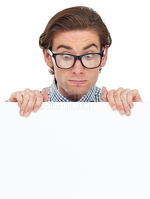 Buy stock photo Looking, shocked and man with poster for mockup in studio isolated on a white background. Board, surprised and male person, geek or nerd with copy space for advertising, marketing or promotion banner