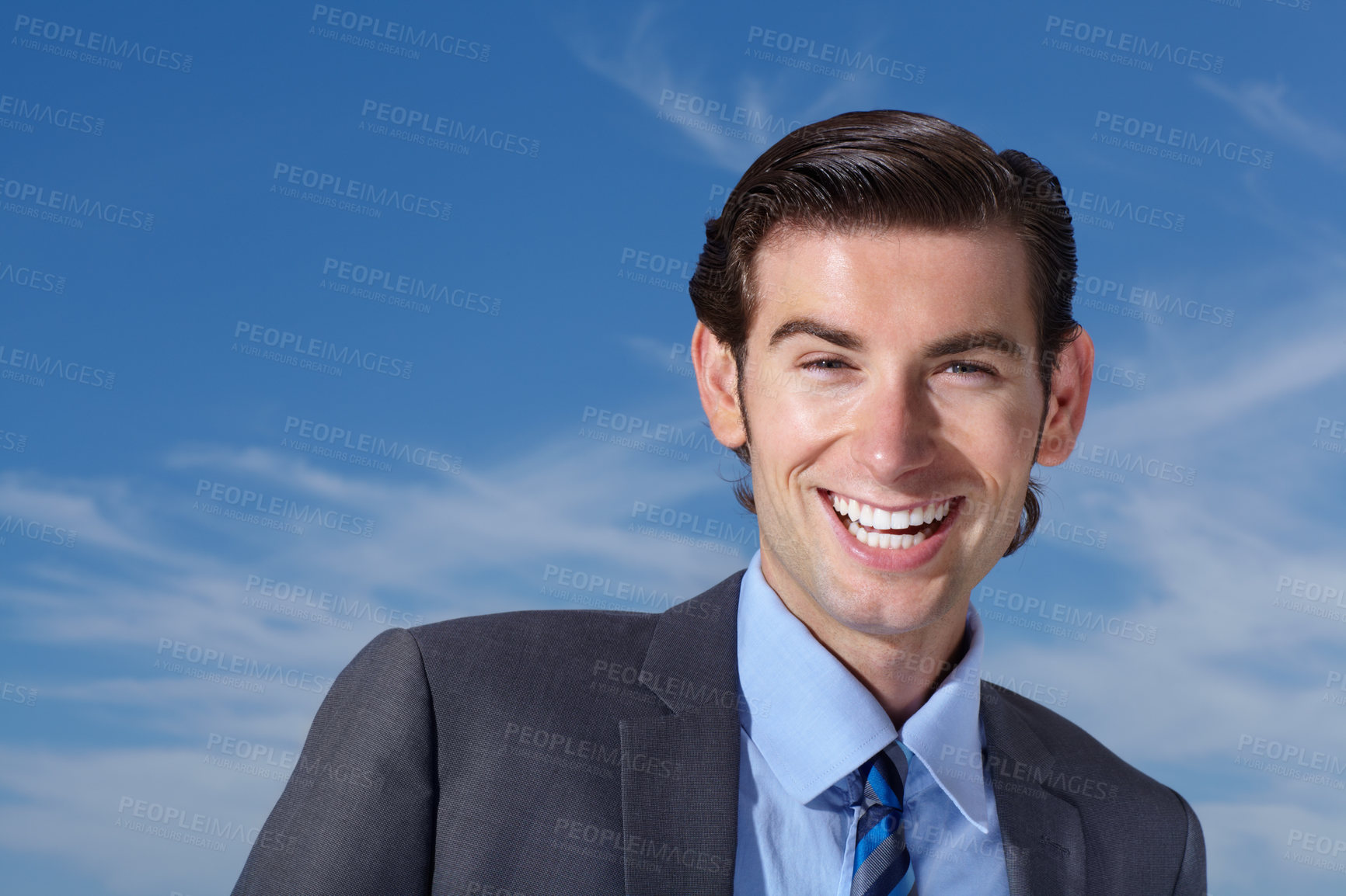 Buy stock photo Portrait, smile and happy man outdoors for business travel against a blue sky background. Face, empowered and businessman person excited while traveling, laughing and cheerful, confident and free