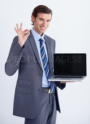 Buy stock photo Perfect, hand and laptop mockup by man portrait in studio with space for advertising on white background. Face, yes and happy business person with ok emoji, vote or positive feedback or online review