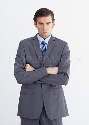 Buy stock photo Anger, crossed arms and portrait of business man on white background with upset, mad and angry expression. Employee, professional and face of male worker with stress, frustrated and annoyed in studio