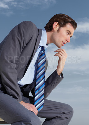 Buy stock photo Thinking, planning and a business man on a blue sky background for corporate vision or development. Profile, idea and future with a young professional employee in a suit outdoor for company growth