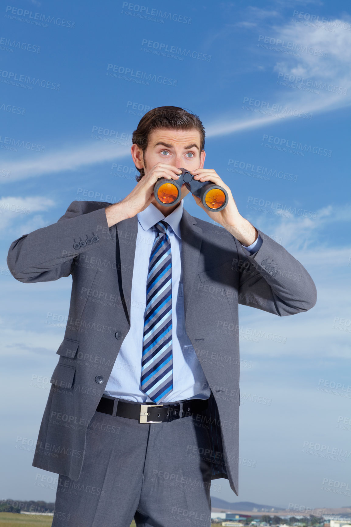 Buy stock photo Businessman, outdoor with binoculars and suit, looking and corporate wear against blue sky. Young man, searching for ideas and outside watching competition for company, professional and alone