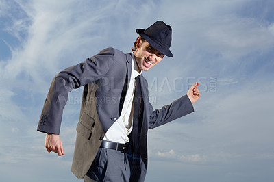 Buy stock photo Business man, dancing and sky with suit, happiness and freedom with success, energy or outdoor for celebration. Young entrepreneur, businessman or dancer with excited face, comic and moving by clouds