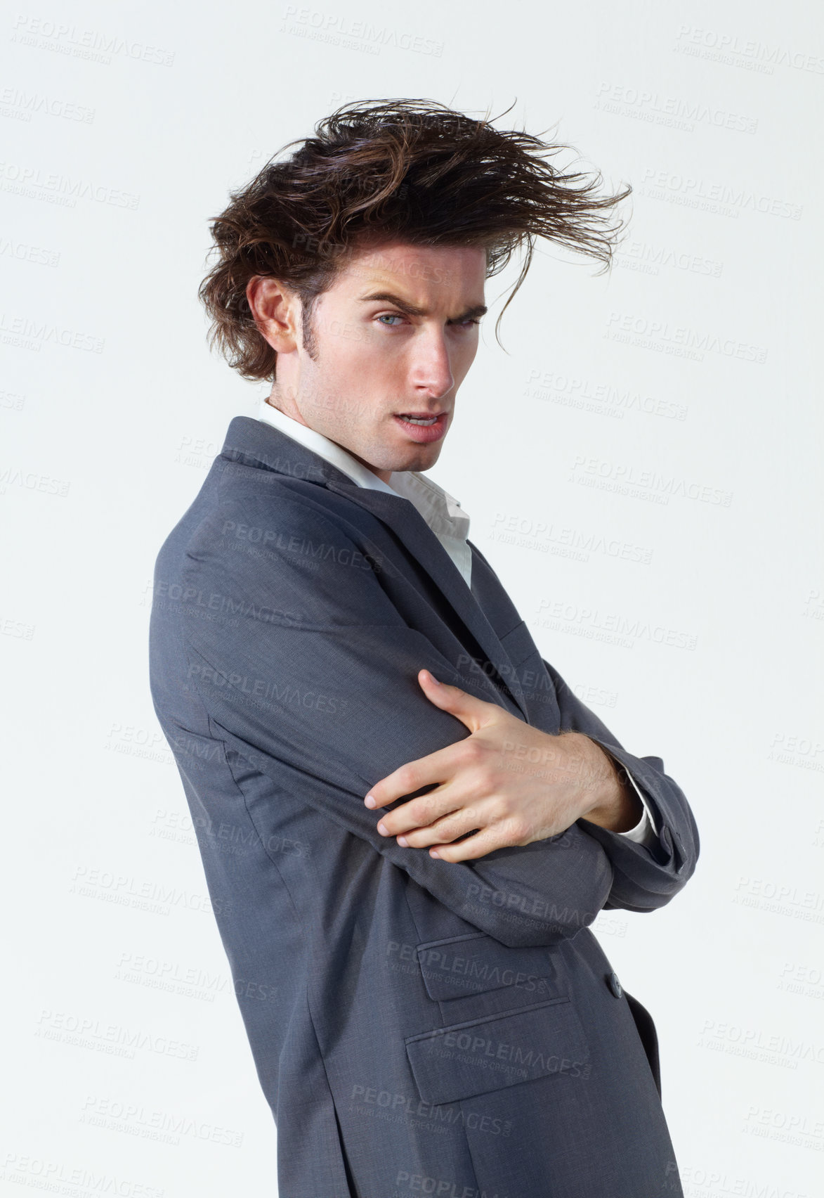 Buy stock photo A young businessman with crazy hair standing on a white background