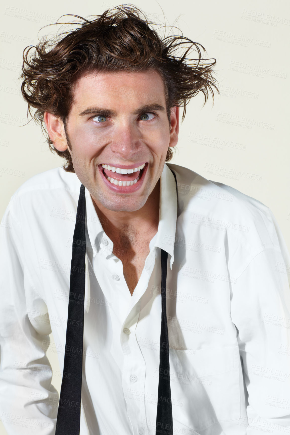 Buy stock photo Crazy, insane and face of man on a white background with stress, crossed eyes and madness. Mental health, anxiety and professional male worker with burnout, stressed out and messy hair in studio