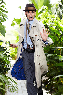 Buy stock photo Detective man, shocked search and portrait in jungle with vintage gear for investigation and solution. Outdoor, private investigator and spy with comedy for surveillance and retro reporter character