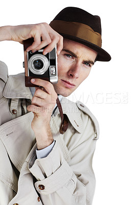 Buy stock photo Reporter taking a photo with a retro camera against a white background while looking away