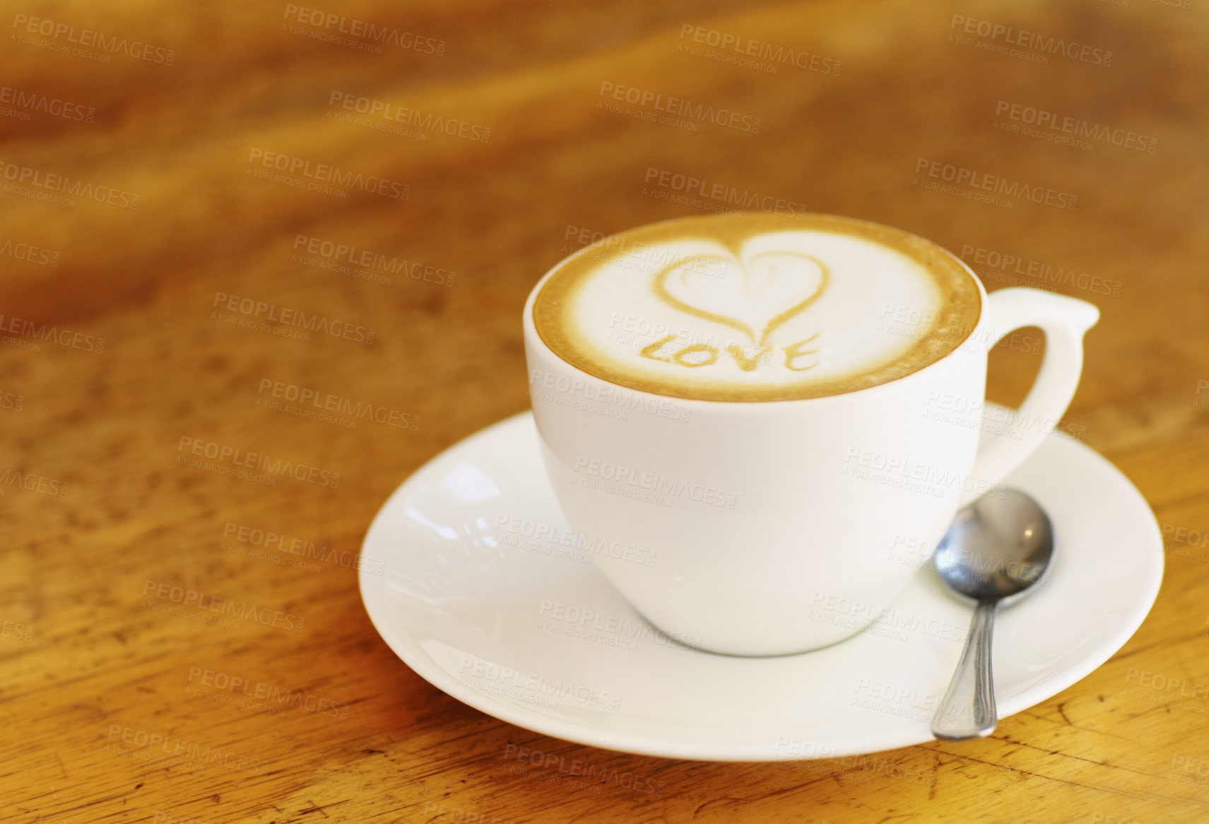 Buy stock photo Coffee, latte and wooden table at vintage cafe with a cup at a restaurant with a plain background. Expresso, kitchen and drink with milk and foam at retro diner for breakfast in the morning with love