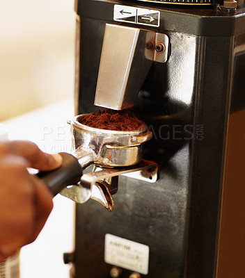 Buy stock photo Hand, coffee grounds and woman barista prepare latte or expresso. Closeup, person working in a restaurant with brewing process and female waiter making a hot drink in a kitchen or cafeteria.
