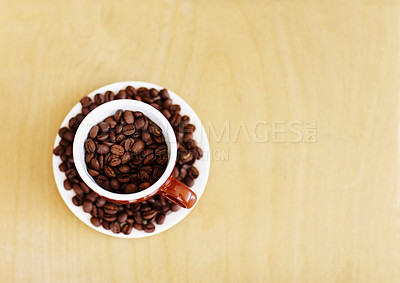 Buy stock photo Coffee beans, roasted and cup for cafe industry with quality product and space for marketing or advertising. Above wooden table mockup background with grain as drink, espresso or caffeine ingredient