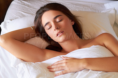 Buy stock photo A beautiful young woman sleeping in her bed