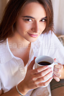 Buy stock photo Portrait, woman drink her coffee in the morning and thinking on sofa in the living room of her home. Peace or freedom, mindfulness or relax and female person drinking hot beverage for stress relief