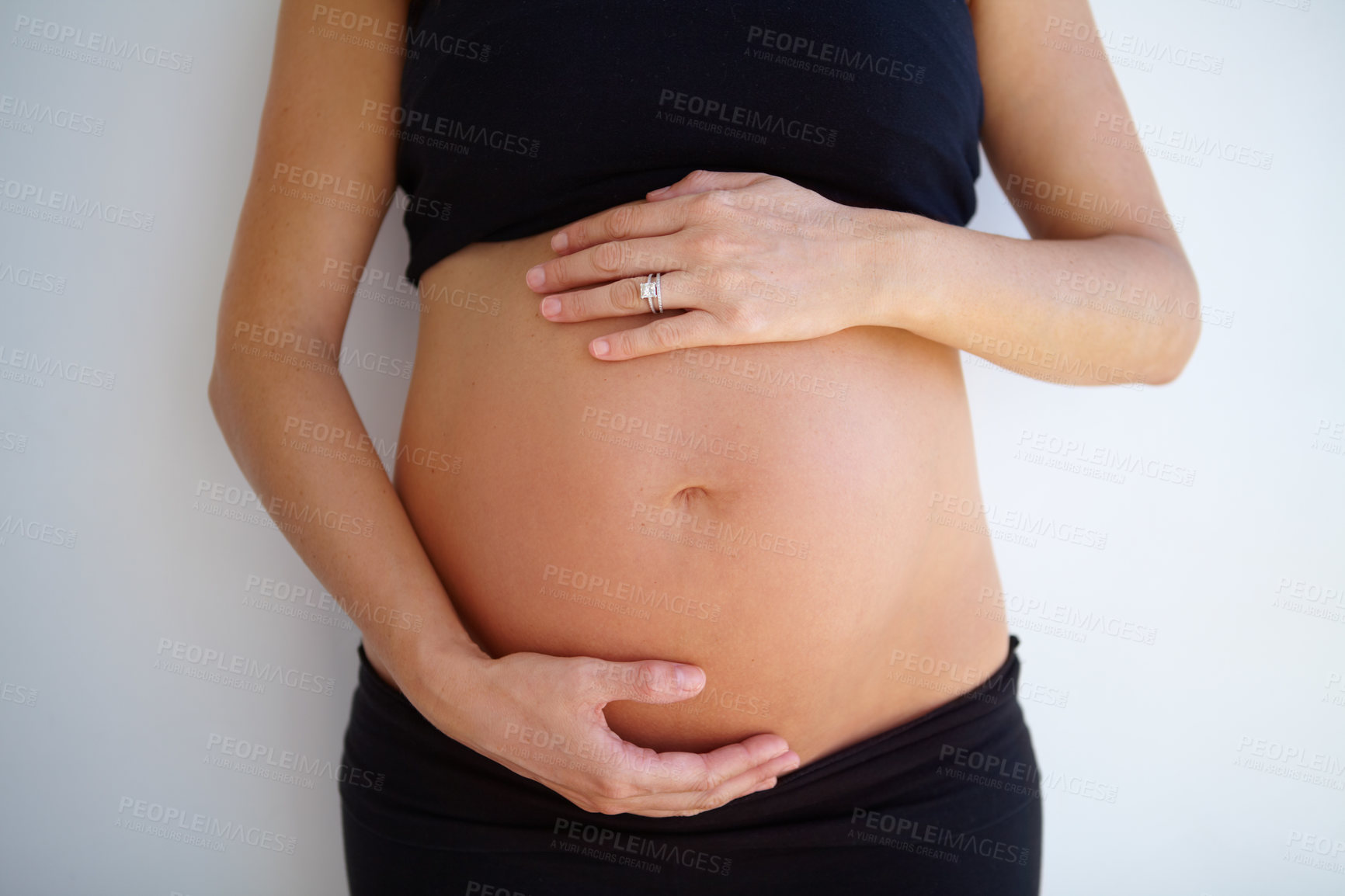 Buy stock photo Pregnancy, woman and hands on stomach with love, care and support for healthy baby or maternity on white background. Pregnant, mother and hand on belly, tummy and wellness of body and motherhood