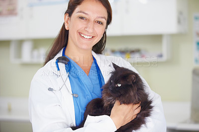 Buy stock photo Portrait of a smiling female vet holding a dark feline