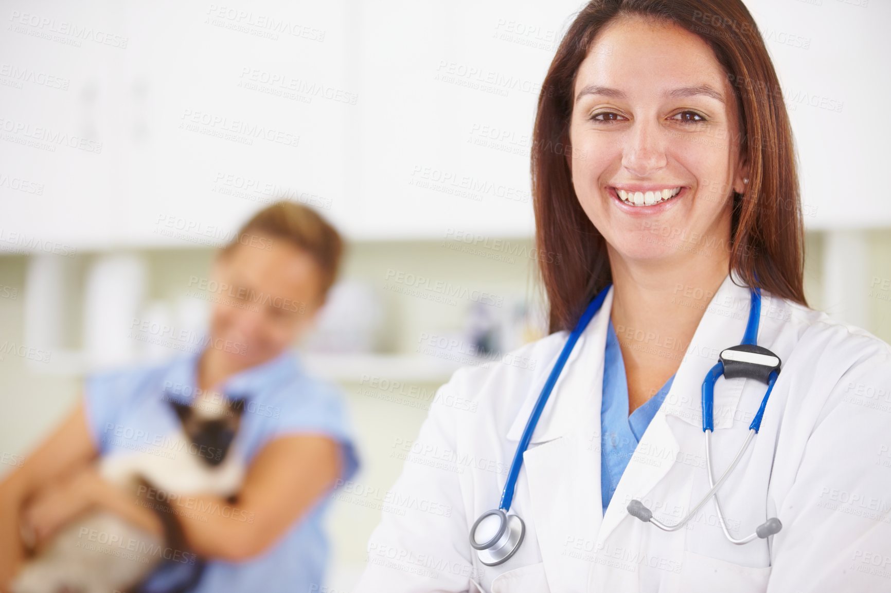Buy stock photo Portrait of a young female vet smiling for the camera