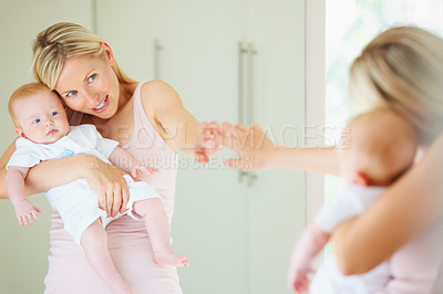 Buy stock photo Mother, baby and smile in mirror, care and love in reflection, home and learning for development. Mom, child and hug or embrace, security and happy family or play, motherhood and creative education