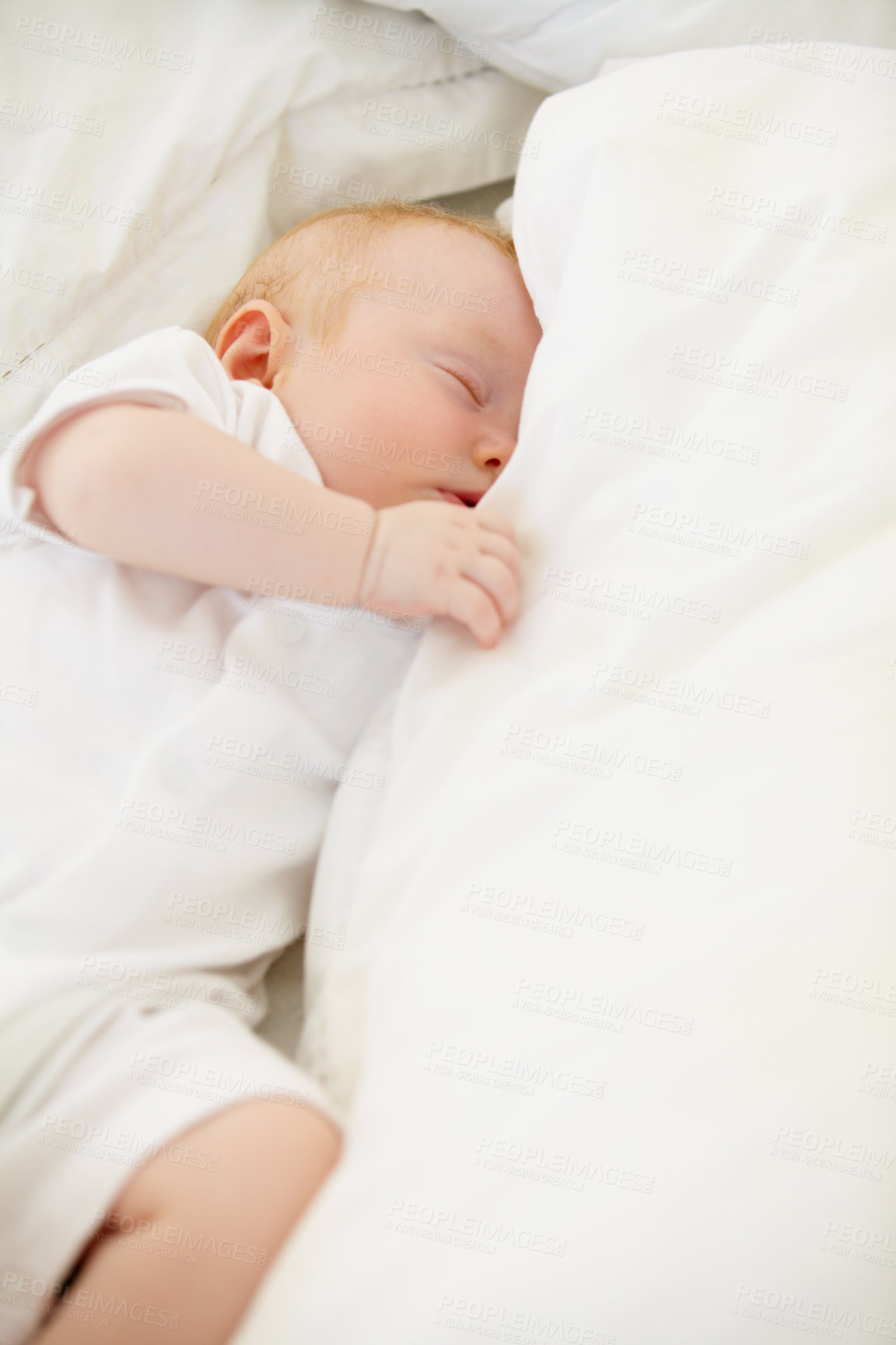 Buy stock photo Sleeping, bed and baby with pillow in home for dreaming, resting and nap for child development. Family, nursery and  comfortable newborn infant in bedroom relax for wellness, health and growth