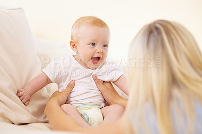 Buy stock photo Mother, baby and laughing at home, play and child development or love, security and bonding. Mom, kid and connection or fun, joy and care in motherhood, happiness and smile or learn to communicate