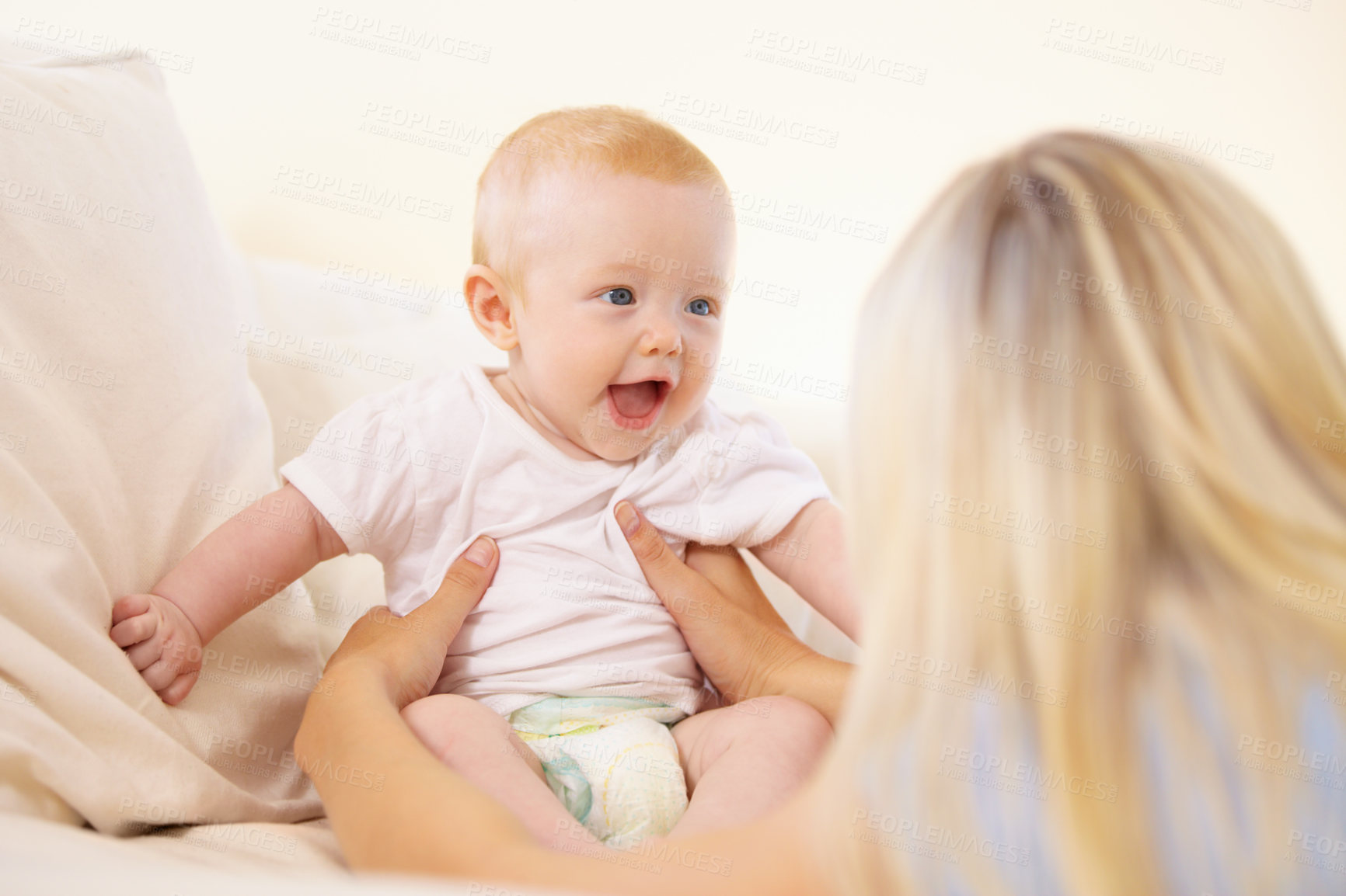 Buy stock photo Mother, baby and laughing at home, play and child development or love, security and bonding. Mom, kid and connection or fun, joy and care in motherhood, happiness and smile or learn to communicate